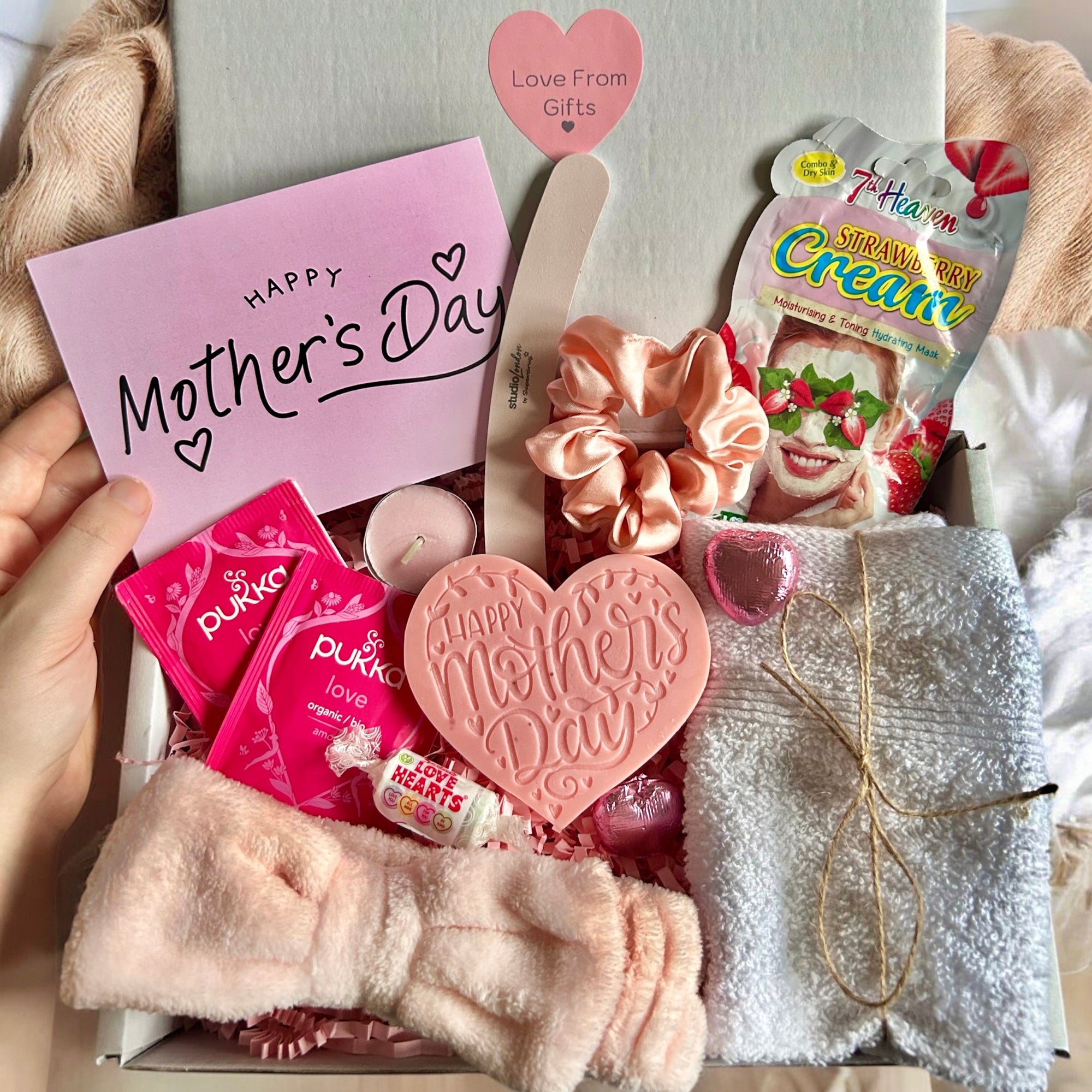 Elegant Mother's Day gift box filled with pampering treats, self-care essentials, and thoughtful surprises. The perfect gift for moms, grandmothers, and mother figures. A beautifully packaged present to show love, appreciation, and gratitude on Mother's Day